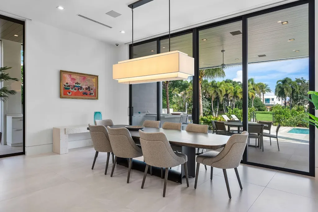 175 W Alexander Palm Road luxury waterfront home for sale in Boca Raton with modern design, private dock, resort-style pool, and Royal Palm Yacht Club location.
