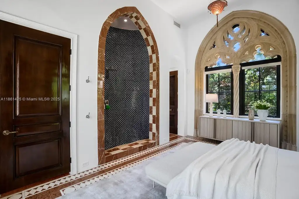 Luxury waterfront estate at 1840 S Bayshore Ln Miami, a $24 million Coconut Grove home for sale with Gothic design, infinity pool, and bay views.