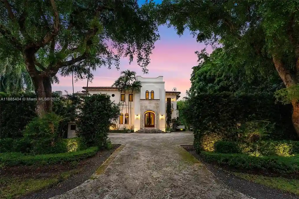 Luxury Mediterranean waterfront estate at 231 Costanera Road Coral Gables with private dock, $11.98M home featuring pool, lush landscaping, and elegant design