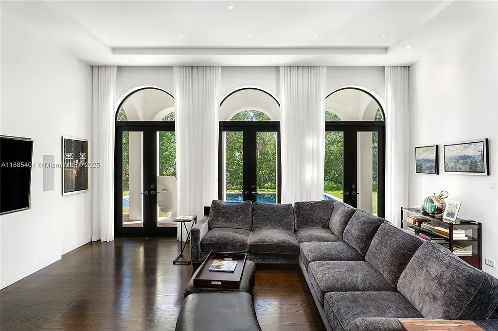 Luxury Mediterranean waterfront estate at 231 Costanera Road Coral Gables with private dock, $11.98M home featuring pool, lush landscaping, and elegant design