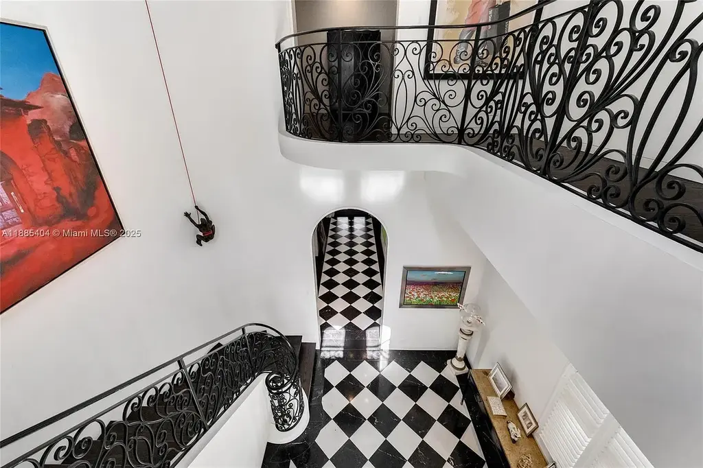 Luxury Mediterranean waterfront estate at 231 Costanera Road Coral Gables with private dock, $11.98M home featuring pool, lush landscaping, and elegant design