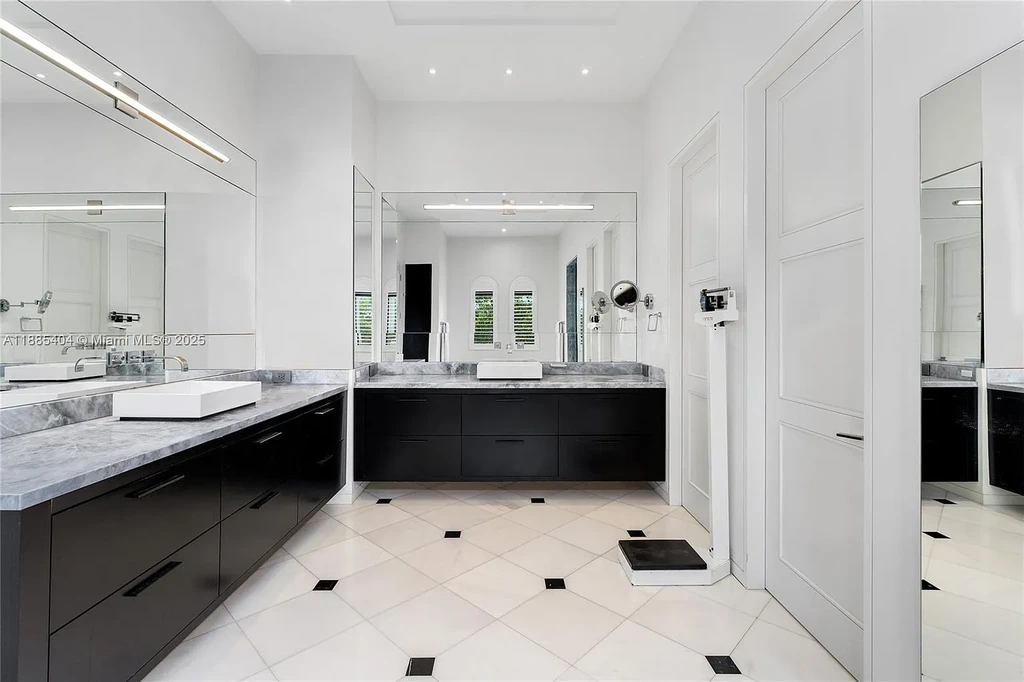 Luxury Mediterranean waterfront estate at 231 Costanera Road Coral Gables with private dock, $11.98M home featuring pool, lush landscaping, and elegant design