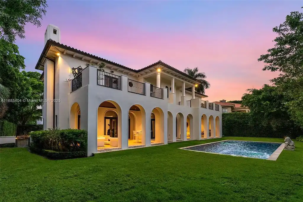 Luxury Mediterranean waterfront estate at 231 Costanera Road Coral Gables with private dock, $11.98M home featuring pool, lush landscaping, and elegant design