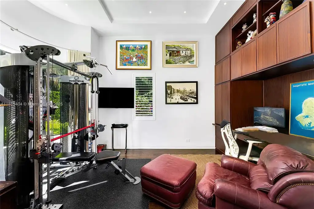Luxury Mediterranean waterfront estate at 231 Costanera Road Coral Gables with private dock, $11.98M home featuring pool, lush landscaping, and elegant design
