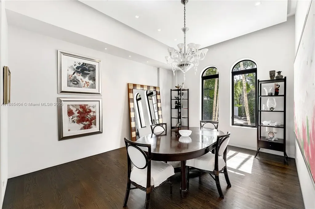 Luxury Mediterranean waterfront estate at 231 Costanera Road Coral Gables with private dock, $11.98M home featuring pool, lush landscaping, and elegant design