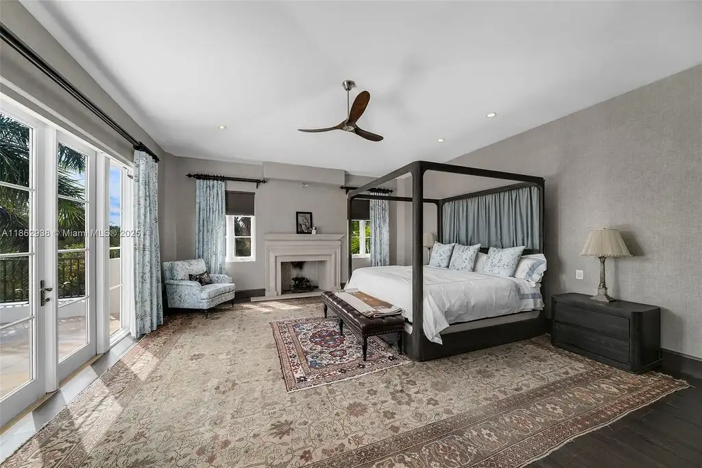 Luxury waterfront estate at 3305 S Moorings Way, Miami, FL 33133 with private dock, pool, 7 bedrooms, 9 bathrooms, and panoramic Biscayne Bay views.