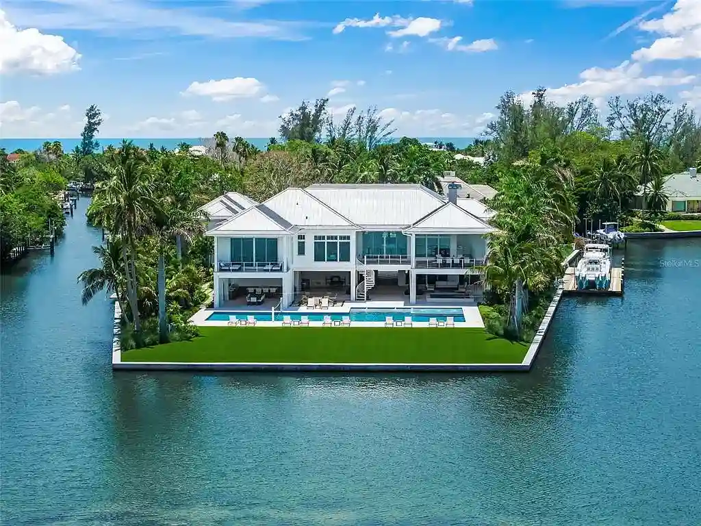 612 Juan Anasco Dr Longboat Key waterfront home for sale – $24M British West Indies estate with 6 bedrooms, 9 baths, 9,243 sq ft, private boat lifts, heated pool, and panoramic Gulf views