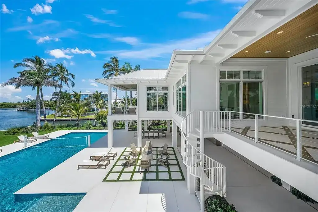 612 Juan Anasco Dr Longboat Key waterfront home for sale – $24M British West Indies estate with 6 bedrooms, 9 baths, 9,243 sq ft, private boat lifts, heated pool, and panoramic Gulf views