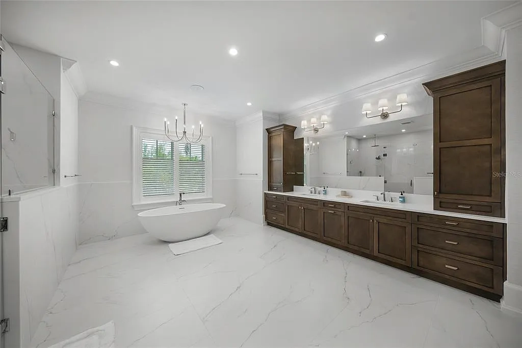 612 Juan Anasco Dr Longboat Key waterfront home for sale – $24M British West Indies estate with 6 bedrooms, 9 baths, 9,243 sq ft, private boat lifts, heated pool, and panoramic Gulf views
