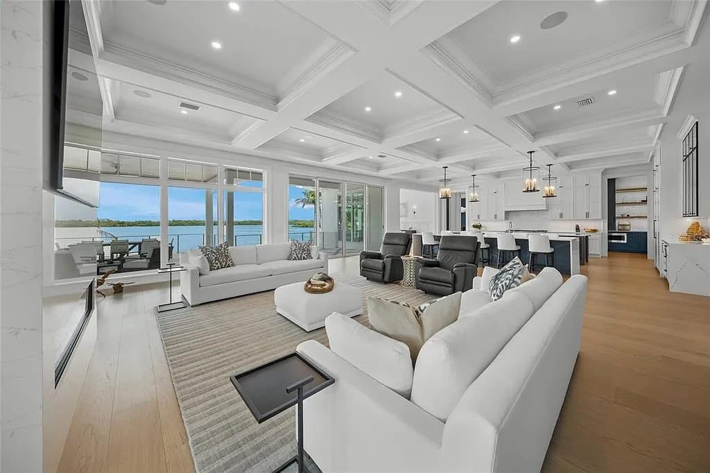 612 Juan Anasco Dr Longboat Key waterfront home for sale – $24M British West Indies estate with 6 bedrooms, 9 baths, 9,243 sq ft, private boat lifts, heated pool, and panoramic Gulf views
