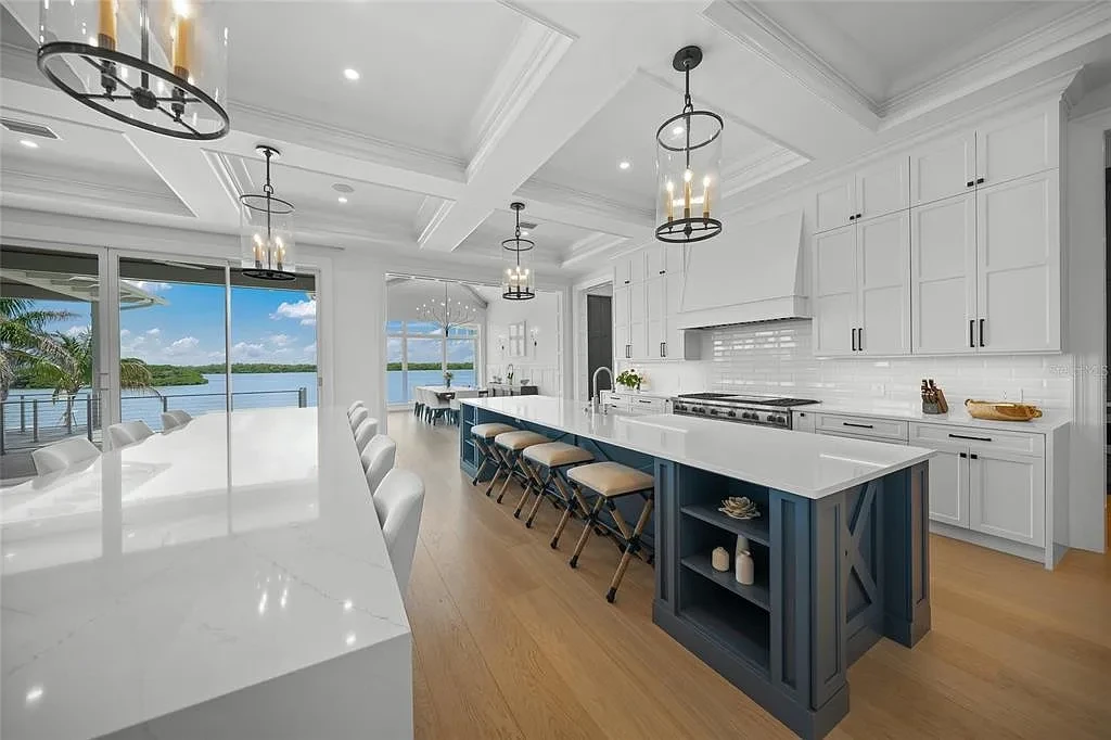 612 Juan Anasco Dr Longboat Key waterfront home for sale – $24M British West Indies estate with 6 bedrooms, 9 baths, 9,243 sq ft, private boat lifts, heated pool, and panoramic Gulf views