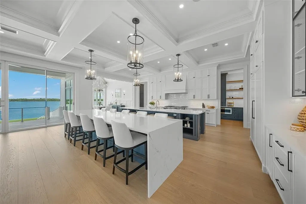 612 Juan Anasco Dr Longboat Key waterfront home for sale – $24M British West Indies estate with 6 bedrooms, 9 baths, 9,243 sq ft, private boat lifts, heated pool, and panoramic Gulf views