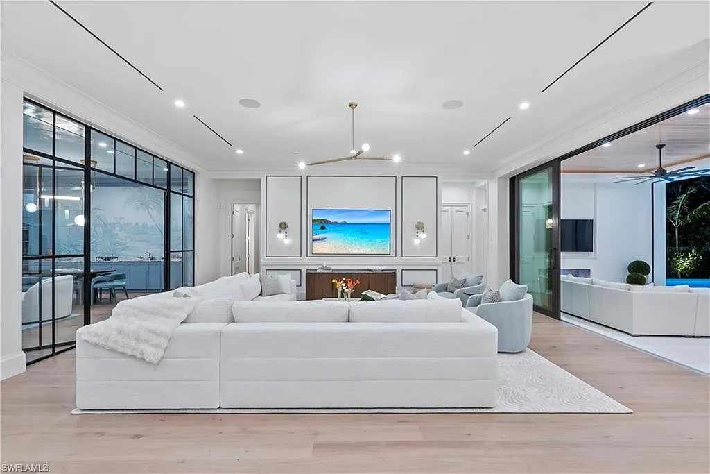 Luxury coastal home at 285 Central AVE Naples FL with pool, outdoor kitchen, and elegant modern interiors.