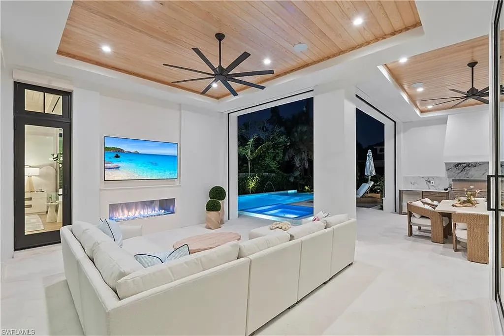 Luxury coastal home at 285 Central AVE Naples FL with pool, outdoor kitchen, and elegant modern interiors.
