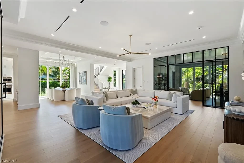 Luxury coastal home at 285 Central AVE Naples FL with pool, outdoor kitchen, and elegant modern interiors.