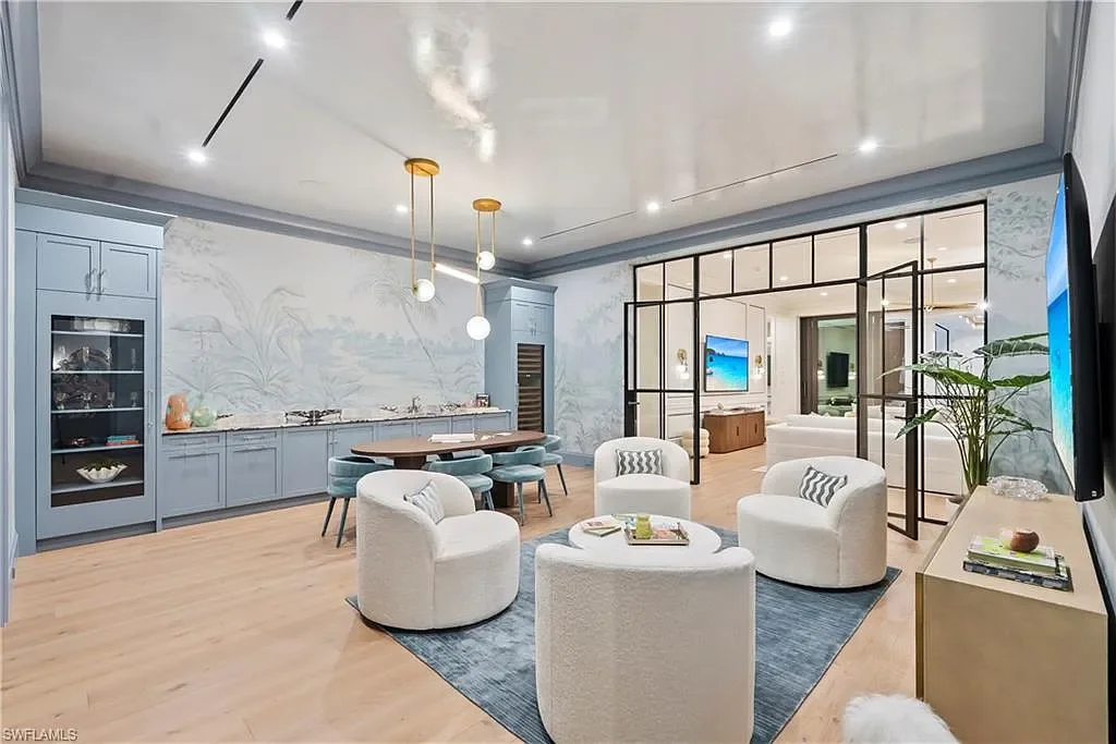 Luxury coastal home at 285 Central AVE Naples FL with pool, outdoor kitchen, and elegant modern interiors.