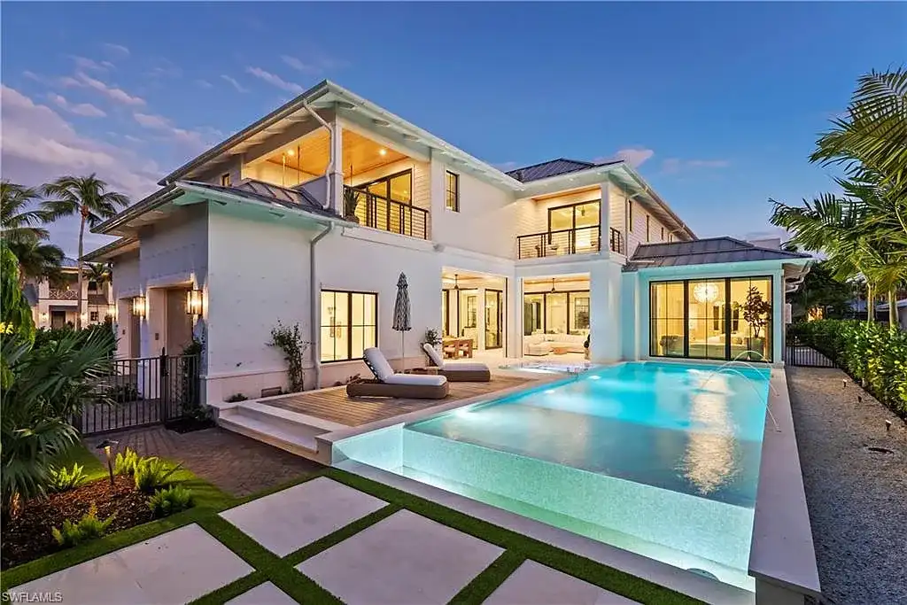 Luxury coastal home at 285 Central AVE Naples FL with pool, outdoor kitchen, and elegant modern interiors.
