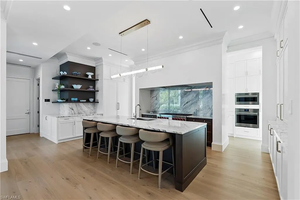Luxury coastal home at 285 Central AVE Naples FL with pool, outdoor kitchen, and elegant modern interiors.