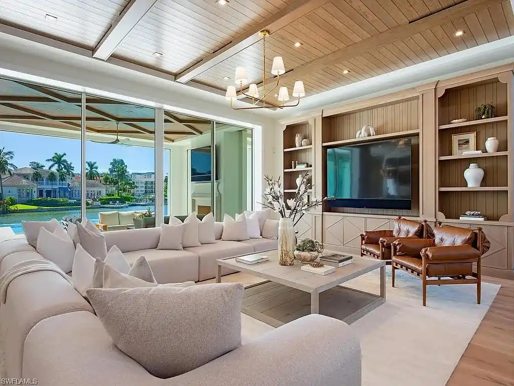 Luxury waterfront home at 306 Spring Line Dr Naples Florida designed by Stofft-Cooney Architects with interiors by Ficarra Design and built by Rise Builders.