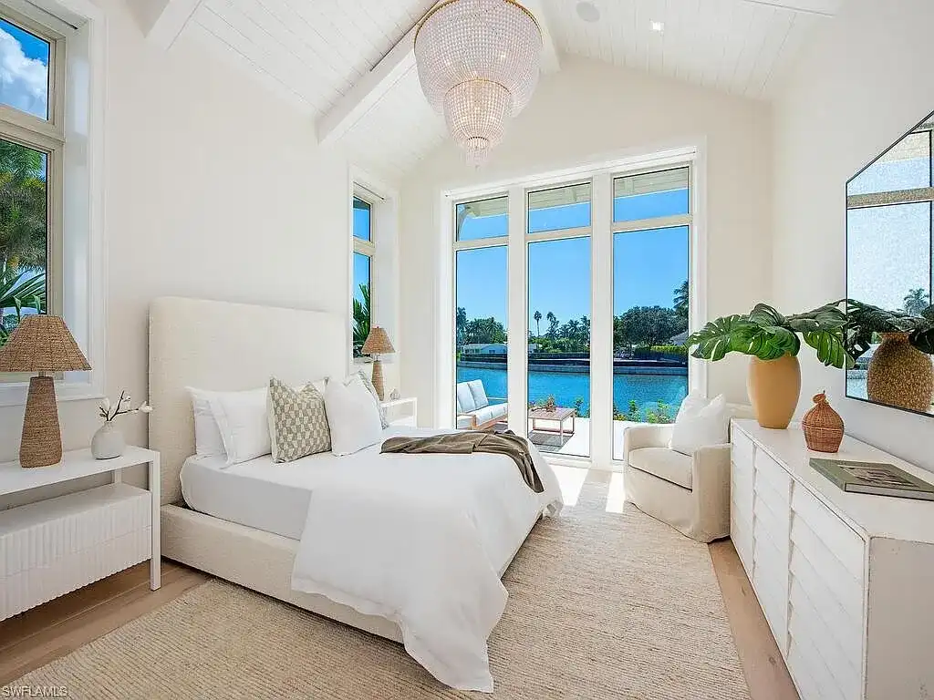 Luxury waterfront home at 306 Spring Line Dr Naples Florida designed by Stofft-Cooney Architects with interiors by Ficarra Design and built by Rise Builders.