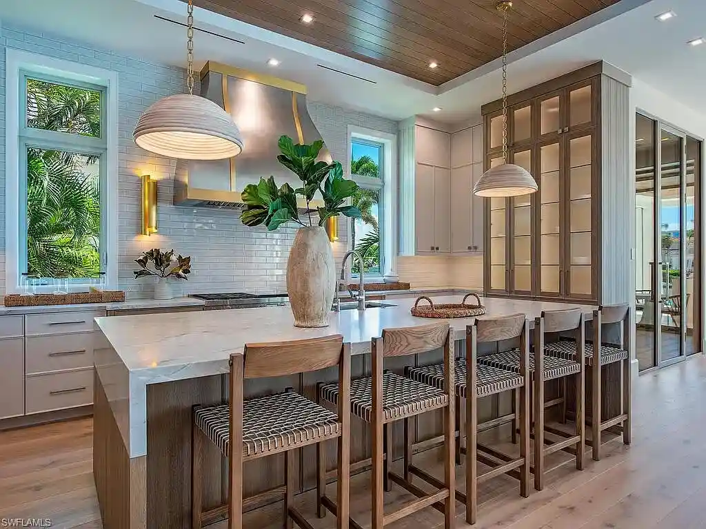 Luxury waterfront home at 306 Spring Line Dr Naples Florida designed by Stofft-Cooney Architects with interiors by Ficarra Design and built by Rise Builders.
