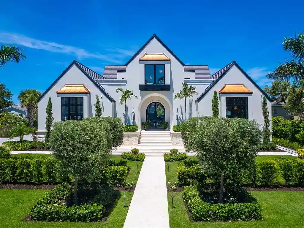 Exterior view of 440 Meadow Lark Dr, Sarasota, a $13.7M waterfront estate with pool, dock, and luxury architectural design
