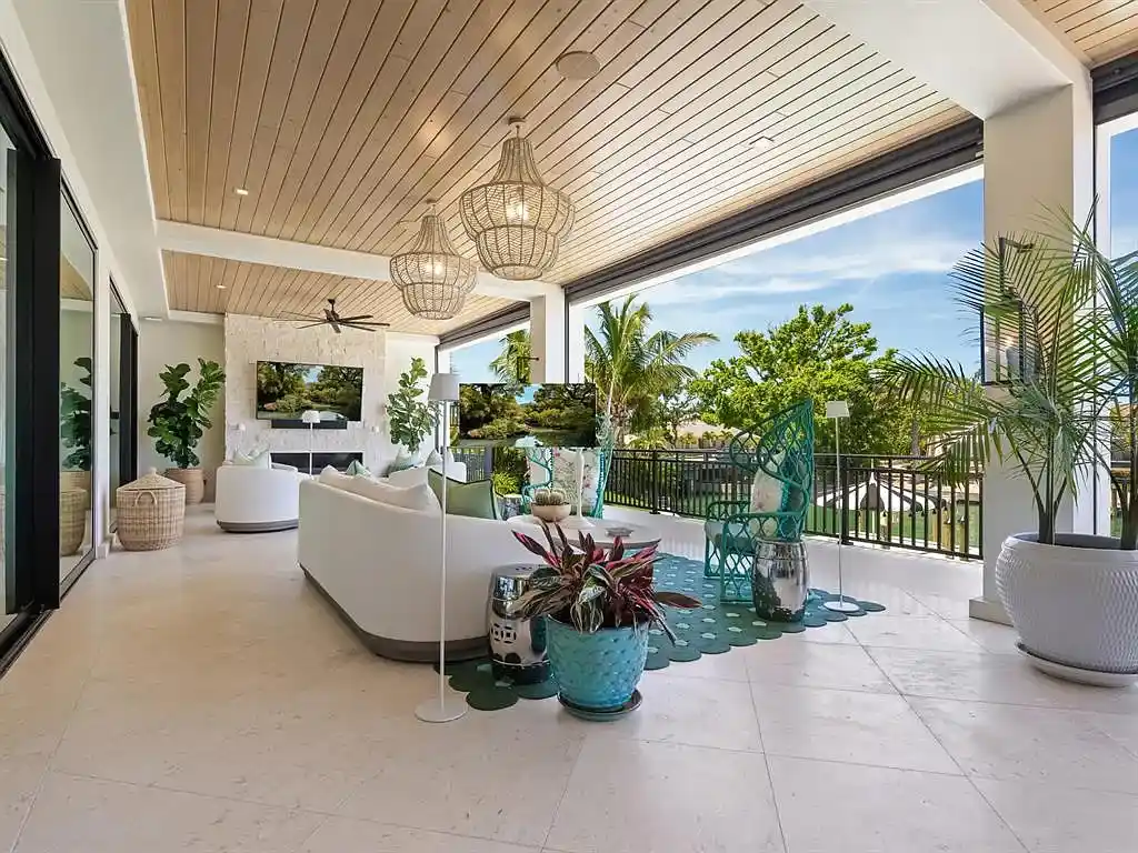 Exterior view of 440 Meadow Lark Dr, Sarasota, a $13.7M waterfront estate with pool, dock, and luxury architectural design