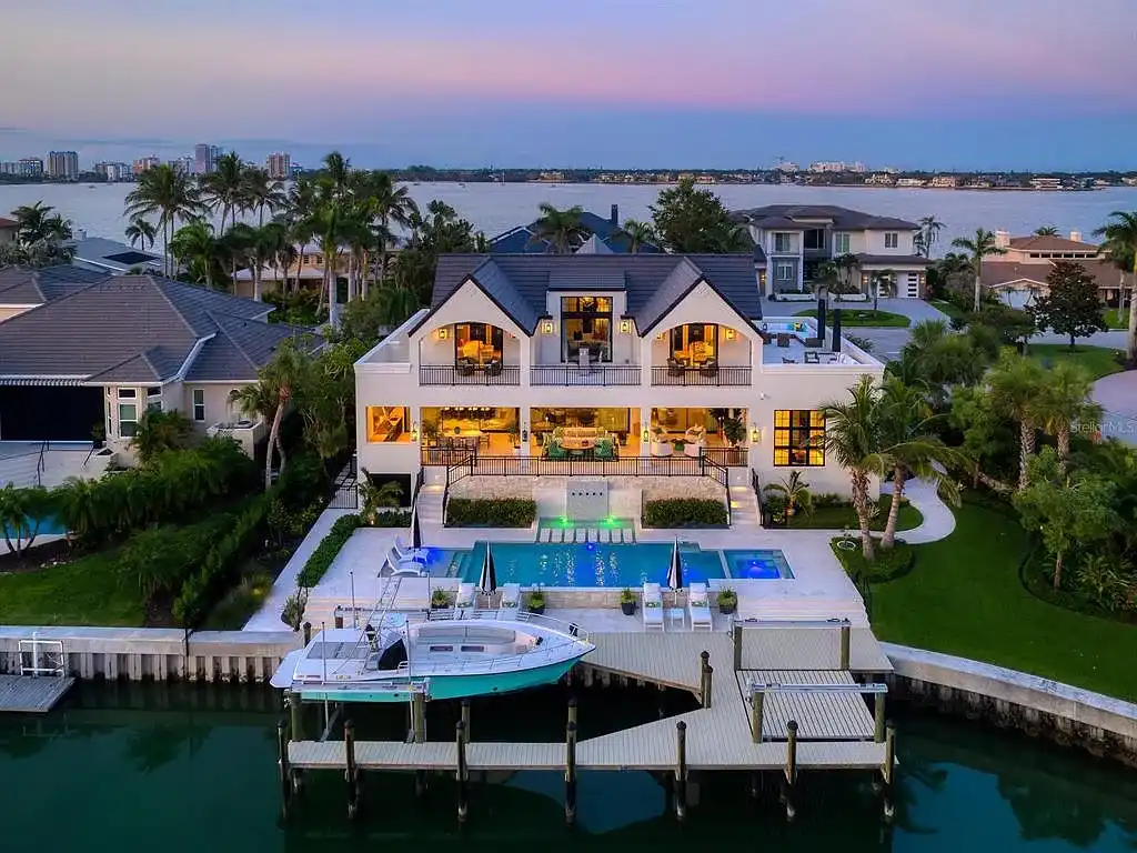 Exterior view of 440 Meadow Lark Dr, Sarasota, a $13.7M waterfront estate with pool, dock, and luxury architectural design