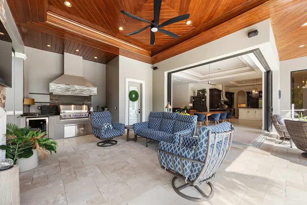 Exterior view of 4517 Brynwood DR Naples FL luxury estate with resort-style pool and landscaped gardens