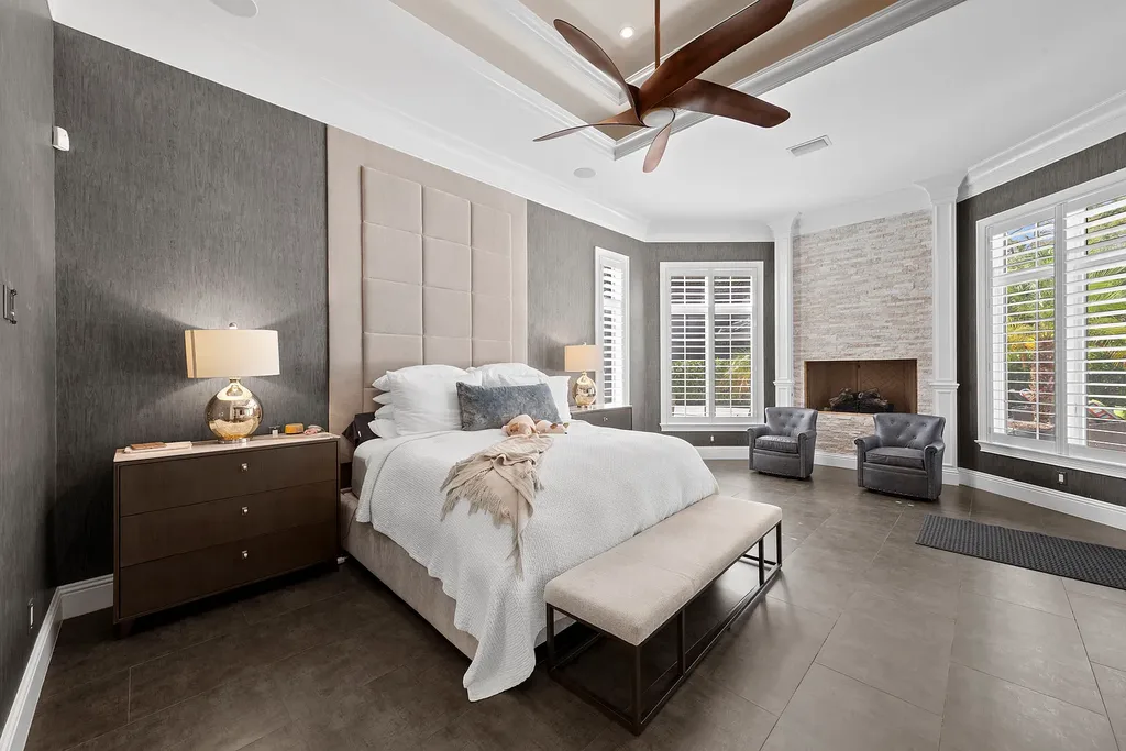 Exterior view of 4517 Brynwood DR Naples FL luxury estate with resort-style pool and landscaped gardens