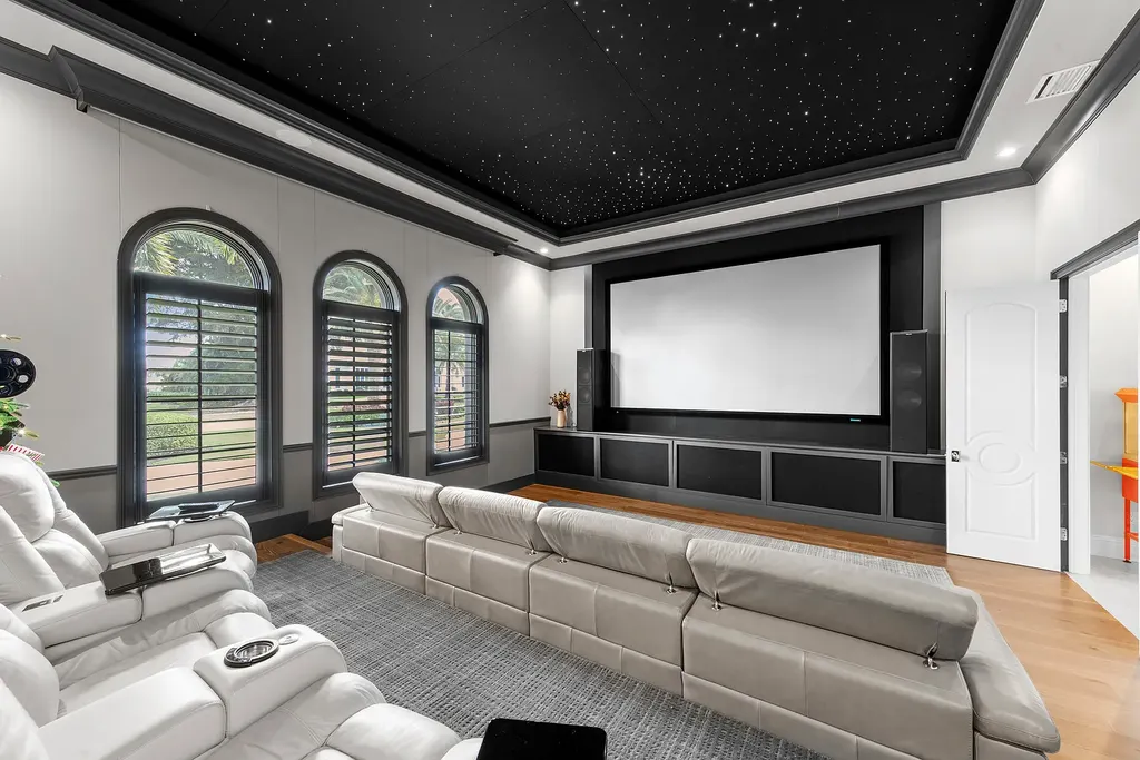 Exterior view of 4517 Brynwood DR Naples FL luxury estate with resort-style pool and landscaped gardens