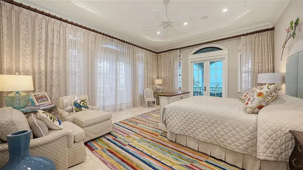 Luxury oceanfront estate at 6001 Gulf Of Mexico Dr in Longboat Key, Florida featuring modern coastal architecture, infinity pool, and panoramic Gulf views, listed for $12 million.