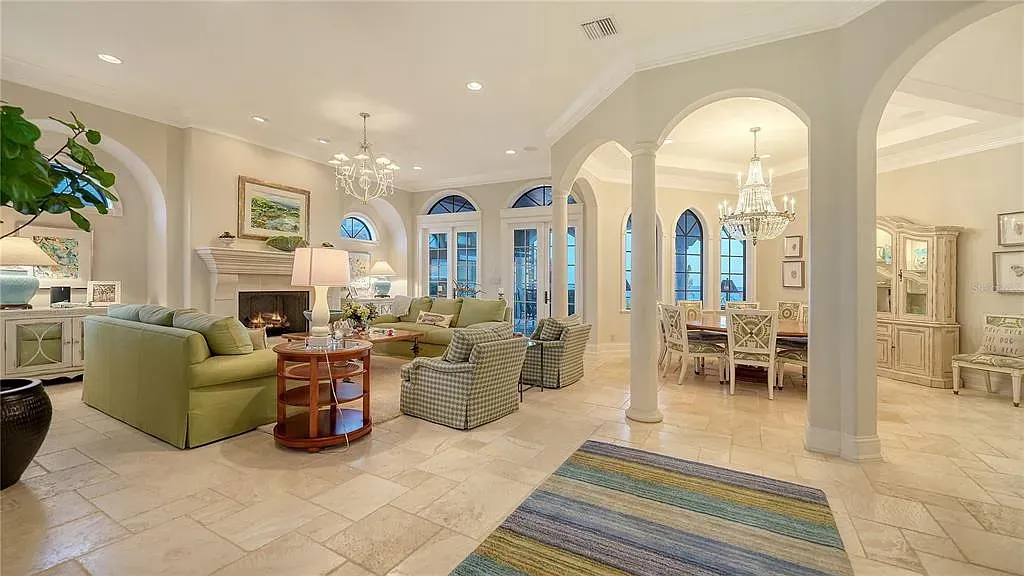 Luxury oceanfront estate at 6001 Gulf Of Mexico Dr in Longboat Key, Florida featuring modern coastal architecture, infinity pool, and panoramic Gulf views, listed for $12 million.
