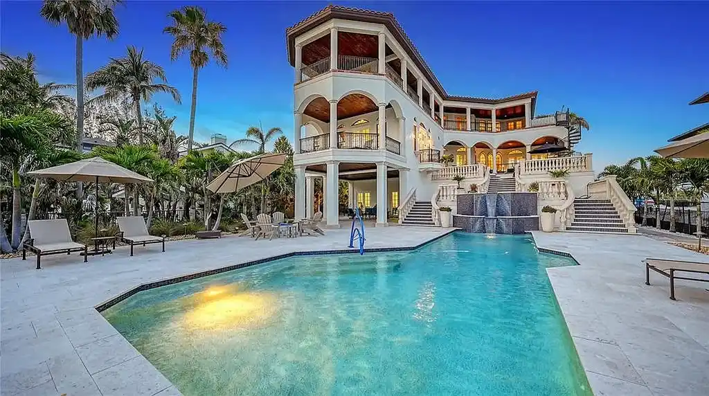 Luxury oceanfront estate at 6001 Gulf Of Mexico Dr in Longboat Key, Florida featuring modern coastal architecture, infinity pool, and panoramic Gulf views, listed for $12 million.