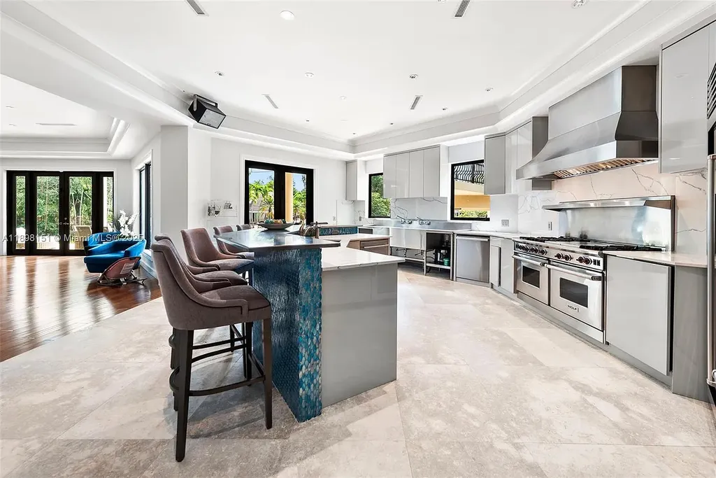 Aerial view of 6700 Granada Blvd, a stunning waterfront Home in Coral Gables for sale with private dock and lush tropical landscape.