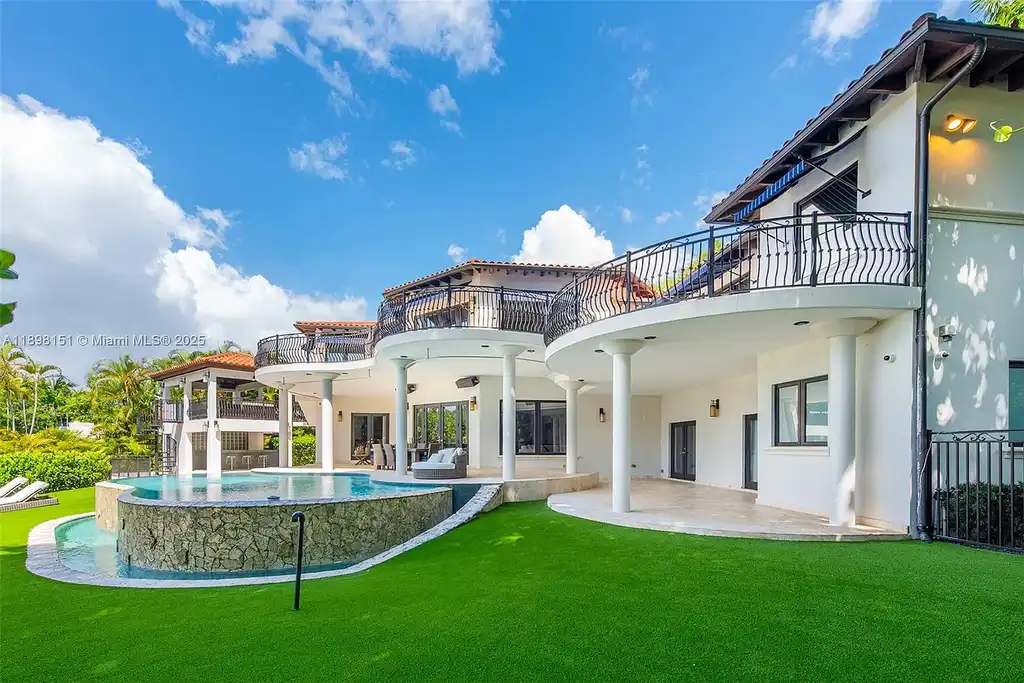 Aerial view of 6700 Granada Blvd, a stunning waterfront Home in Coral Gables for sale with private dock and lush tropical landscape.