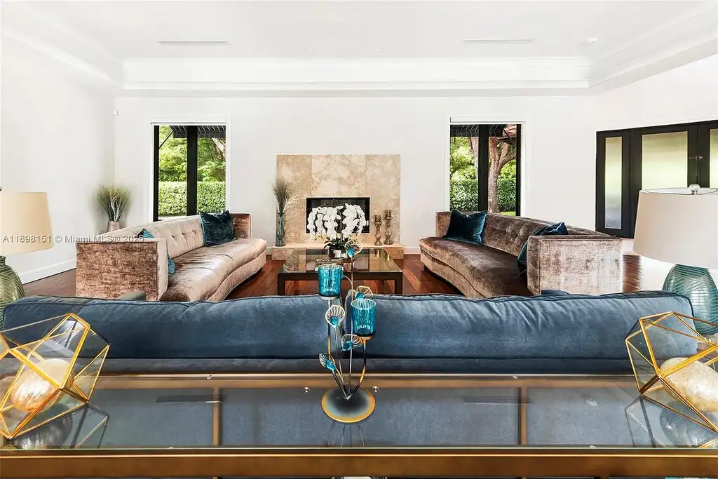 Aerial view of 6700 Granada Blvd, a stunning waterfront Home in Coral Gables for sale with private dock and lush tropical landscape.