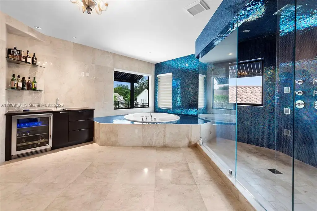 Aerial view of 6700 Granada Blvd, a stunning waterfront Home in Coral Gables for sale with private dock and lush tropical landscape.