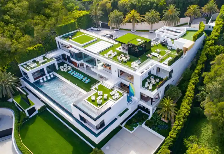 924 Bel Air Road, the modern mansion once listed for $250M, sold for $94M.
