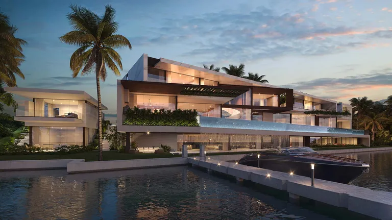 Aerial twilight view of the Manalapan estate showing private dock, guest house, and ocean-to-Intracoastal grounds.