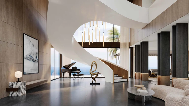 Grand entry hall with sculptural staircase and ocean view inside the most expensive home in Florida.
