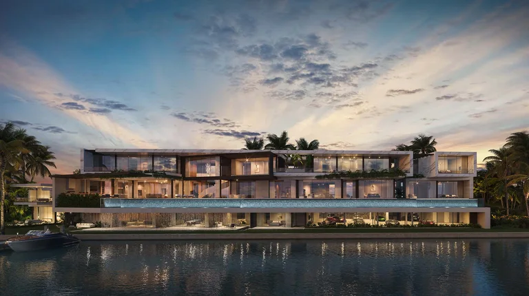 Waterfront exterior of the most expensive home in Florida at 1960 S Ocean Boulevard, Manalapan, showing full glass façade and infinity pool.