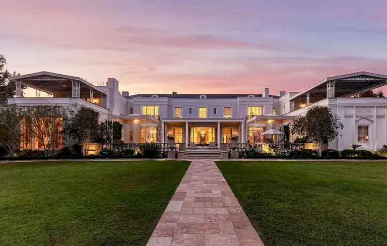 Casa Encantada front facade at sunset — 190 million dollar Art Deco mansion in Bel Air Los Angeles.