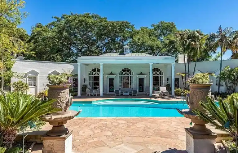 Outdoor pool and garden pavilion at Casa Encantada Bel Air Los Angeles.