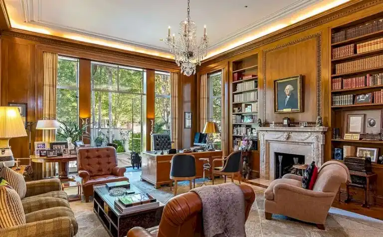 Private study with bookshelves and marble fireplace inside Casa Encantada Bel Air.