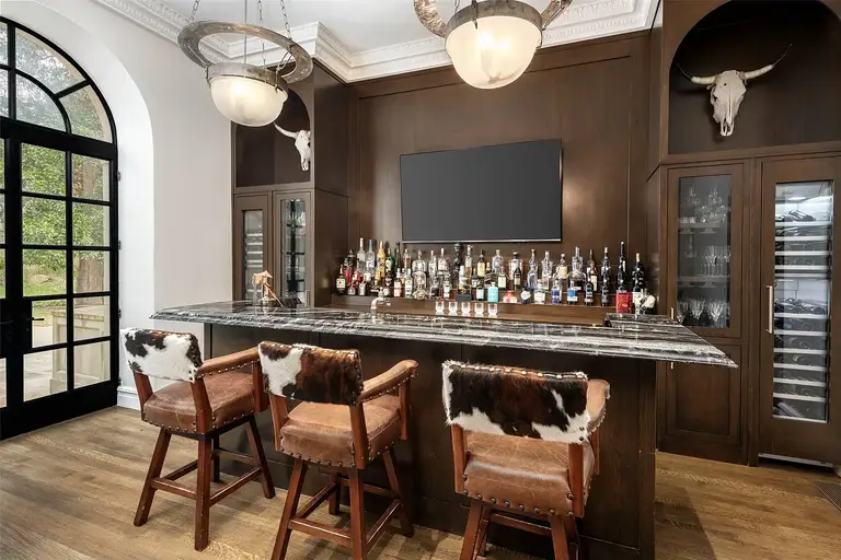 Art Deco-style bar with marble countertop inside the most expensive home in Texas.