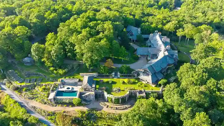 Drone view of Sagee Manor, the most expensive house in North Carolina, showcasing its expansive landscaped gardens, heated pool, and intricate estate layout.
