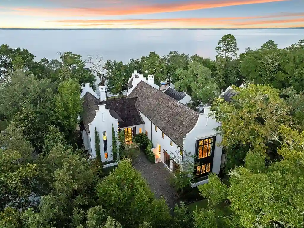 Luxury bayfront estate at 147 Ansley Forest Dr, Santa Rosa Beach, featuring private dock, pool house, 6 bedrooms, 7 bathrooms, and contemporary coastal design with panoramic water views.
