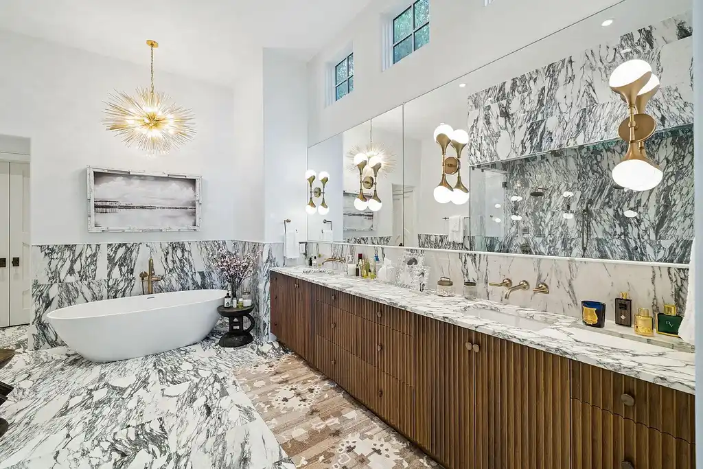 Luxury bayfront estate at 147 Ansley Forest Dr, Santa Rosa Beach, featuring private dock, pool house, 6 bedrooms, 7 bathrooms, and contemporary coastal design with panoramic water views.