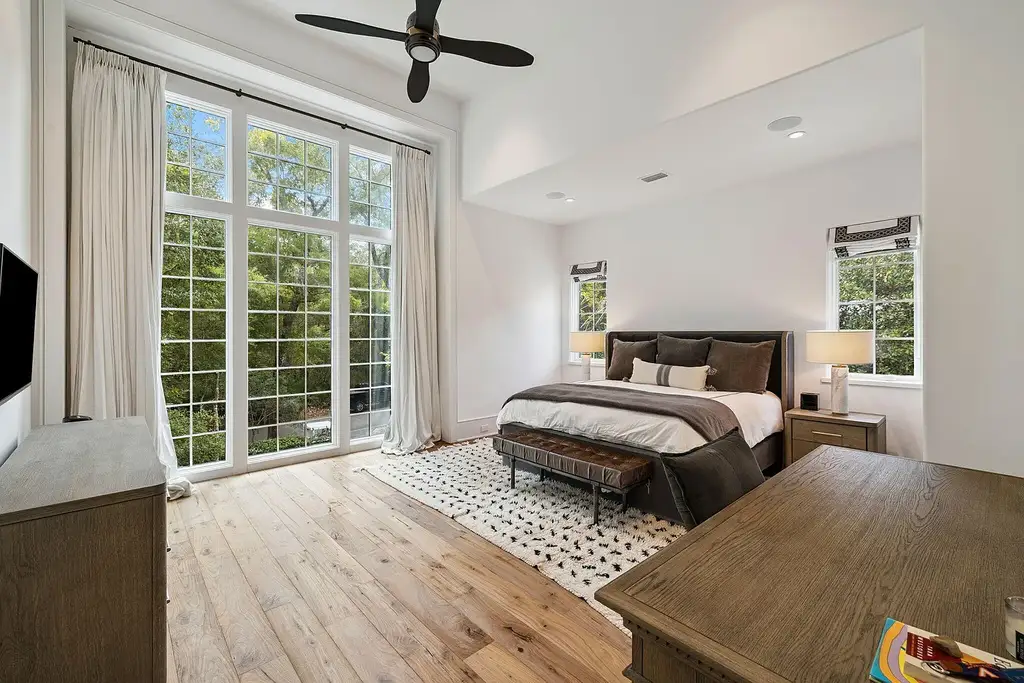 Luxury bayfront estate at 147 Ansley Forest Dr, Santa Rosa Beach, featuring private dock, pool house, 6 bedrooms, 7 bathrooms, and contemporary coastal design with panoramic water views.